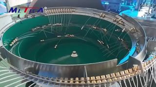 香水充填圧着ラベル貼付機モノブロック